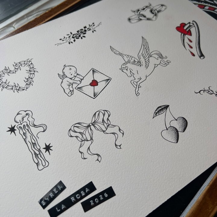A flash sheet with a pegasus, a cherub carrying an envelope, a barbed-wire heart and cherries.